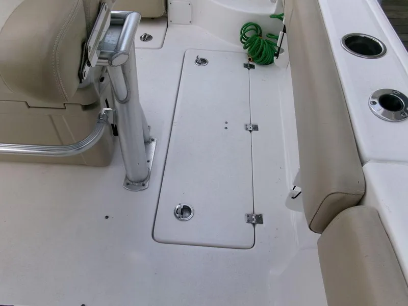 Slide: The Image of 2018 Sea Fox 266 Commander boat interior with seating and storage compartment. - 26