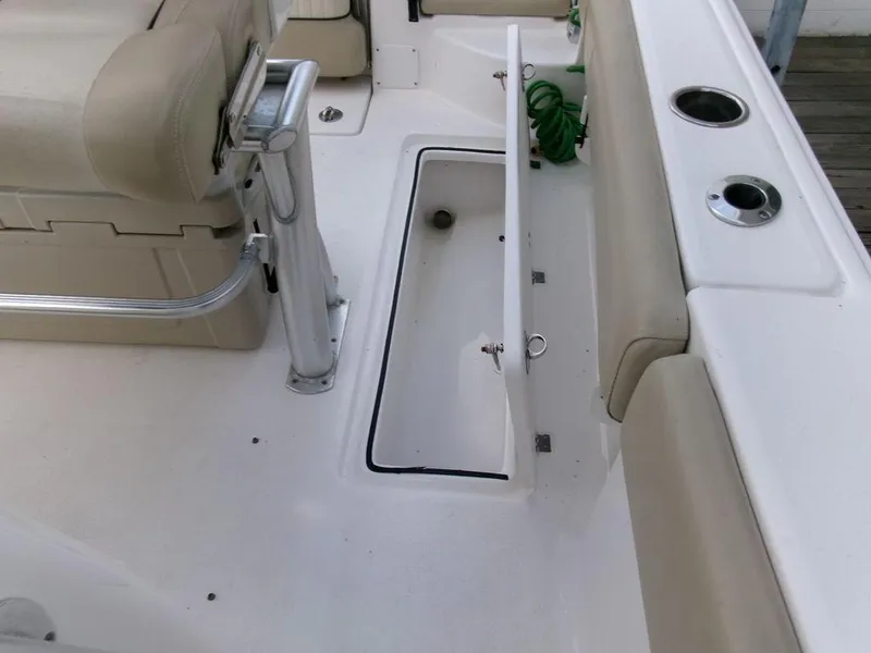 Slide: The Image of 2018 Sea Fox 266 Commander boat interior with open storage compartment and seating. - 27