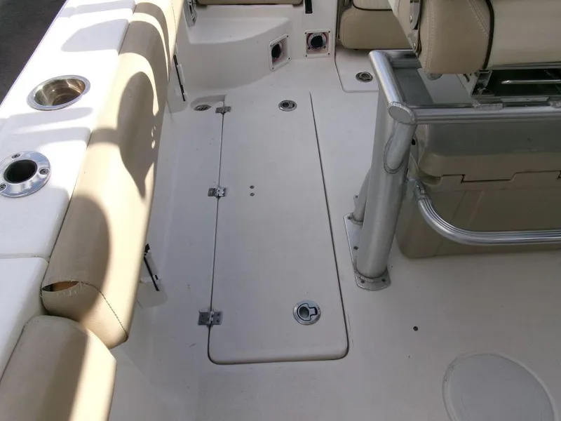 Slide: The Image of 2018 Sea Fox 266 Commander boat interior with beige seating and storage compartments. - 28