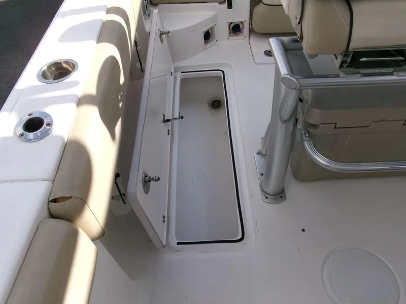 Slide: The Image of 2018 Sea Fox 266 Commander boat interior with open storage compartment and seating. - 29