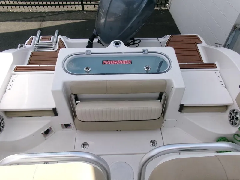 Slide: The Image of 2018 Sea Fox 266 Commander boat deck with seating and storage compartments. - 30