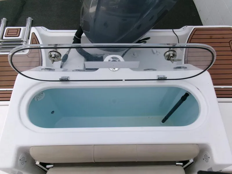 Slide: The Image of Livewell on 2018 Sea Fox 266 Commander boat, featuring a clear lid and seating. - 32