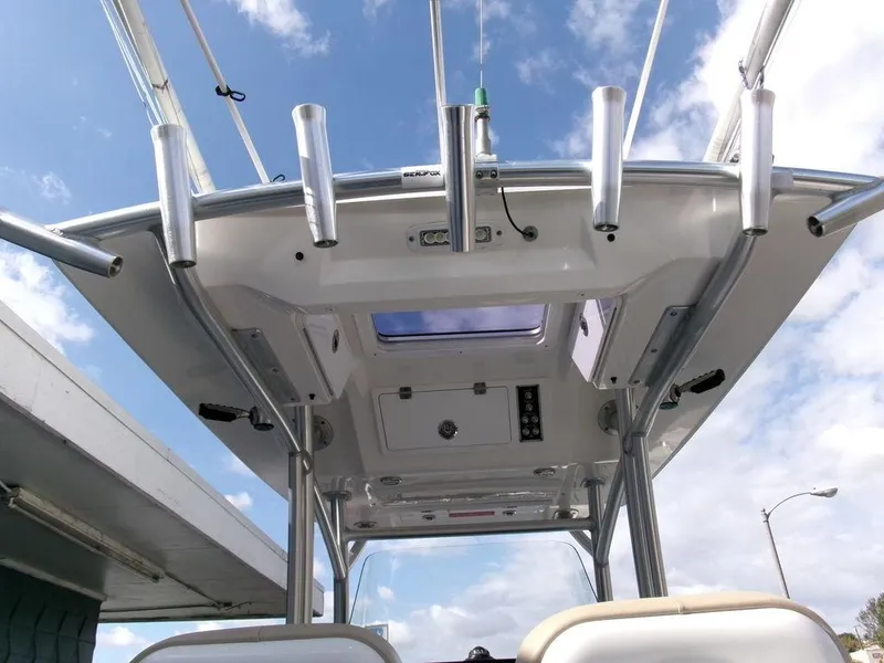 Slide: The Image of 2018 Sea Fox 266 Commander boat roof with rod holders against a blue sky. - 33