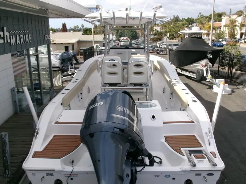 Slide: The Image of 2018 Sea Fox 266 Commander boat with Yamaha engine, docked at a marina. - 38