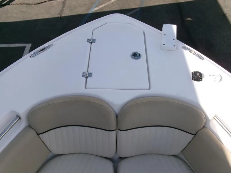 Slide: The Image of 2018 Sea Fox 266 Commander boat bow with cushioned seating and storage hatch. - 4