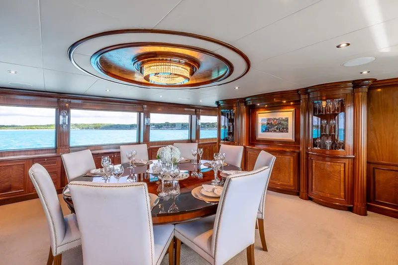 Slide: The Image of Luxurious dining area on 2007 Richmond Yachts Semi Displacement, featuring elegant wood paneling and ocean views. - 11