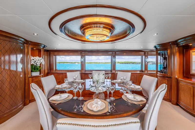 Slide: The Image of Luxurious dining area on 2007 Richmond Yachts Semi Displacement, featuring elegant wood and ocean views. - 12