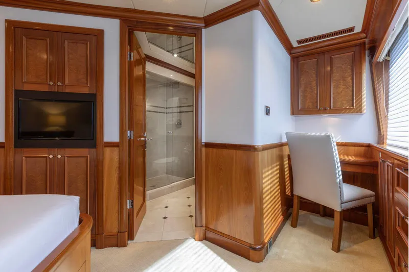 Slide: The Image of Luxurious Richmond Yachts 2007 interior with wood paneling, desk, and ensuite bathroom. - 23
