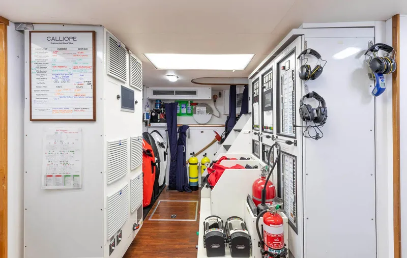 Slide: The Image of Engine room of 2007 Richmond Yachts Semi Displacement, featuring safety equipment and control panels. - 25