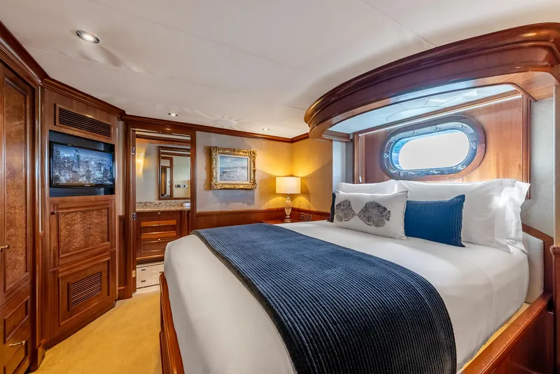 Slide: The Image of Luxurious bedroom in 2007 Richmond Yachts Semi Displacement, featuring elegant wood finishes and cozy bedding. - 18