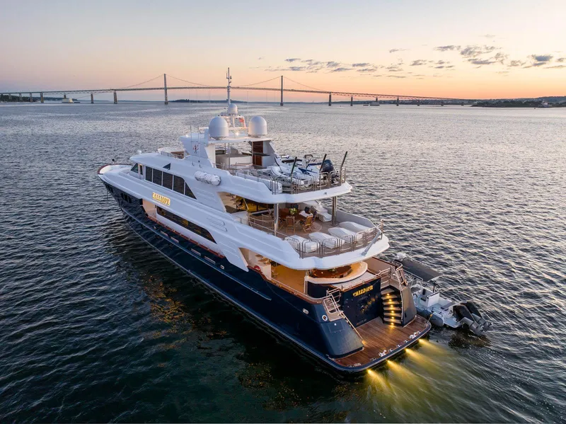 Slide: The Image of Luxurious 2007 Richmond Yachts Semi Displacement yacht cruising at sunset near a bridge. - 5