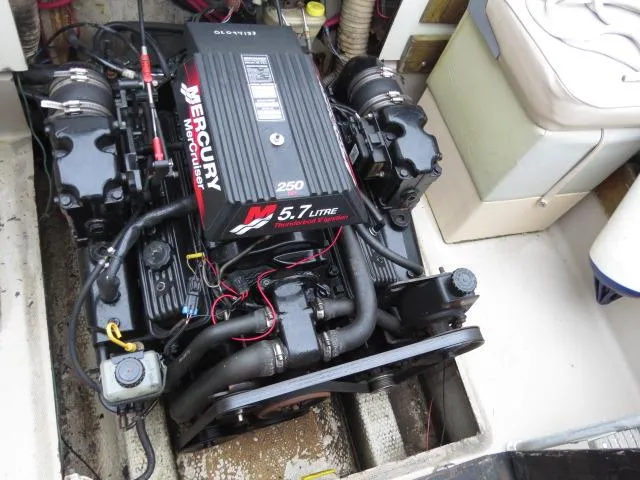 Slide: The Image of 1973 Slickcraft SS235 boat engine, Mercury 5.7L, 250 horsepower, inboard motor setup. - 10