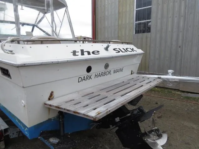 Slide: The Image of 1973 Slickcraft SS235 boat with "The Slick" name, docked in Dark Harbor, Maine. - 2