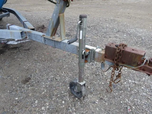 Slide: The Image of Trailer hitch and jack stand for 1973 Slickcraft SS235 boat on gravel surface. - 21