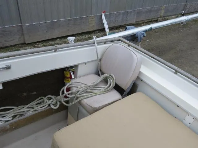 Slide: The Image of 1973 Slickcraft SS235 boat interior with seating, rope, and fire extinguisher. - 9