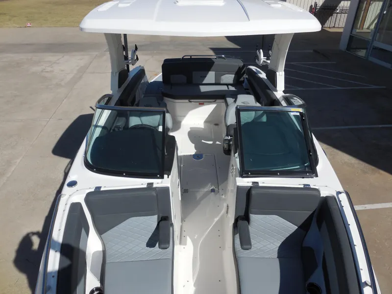Slide: The Image of 2025 Chaparral 26 Surf boat interior with sleek seating and modern design. - 14