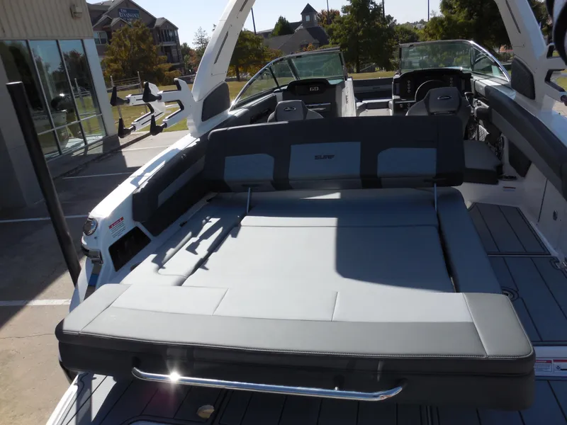 Slide: The Image of 2025 Chaparral 26 Surf boat interior with spacious seating and modern design. - 8