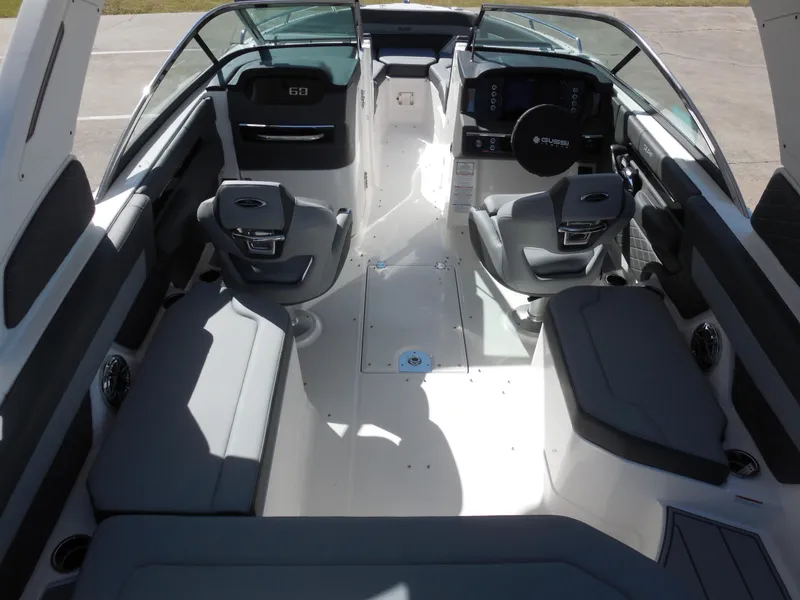 Slide: The Image of Interior of 2025 Chaparral 26 Surf boat with modern seating and dashboard. - 9