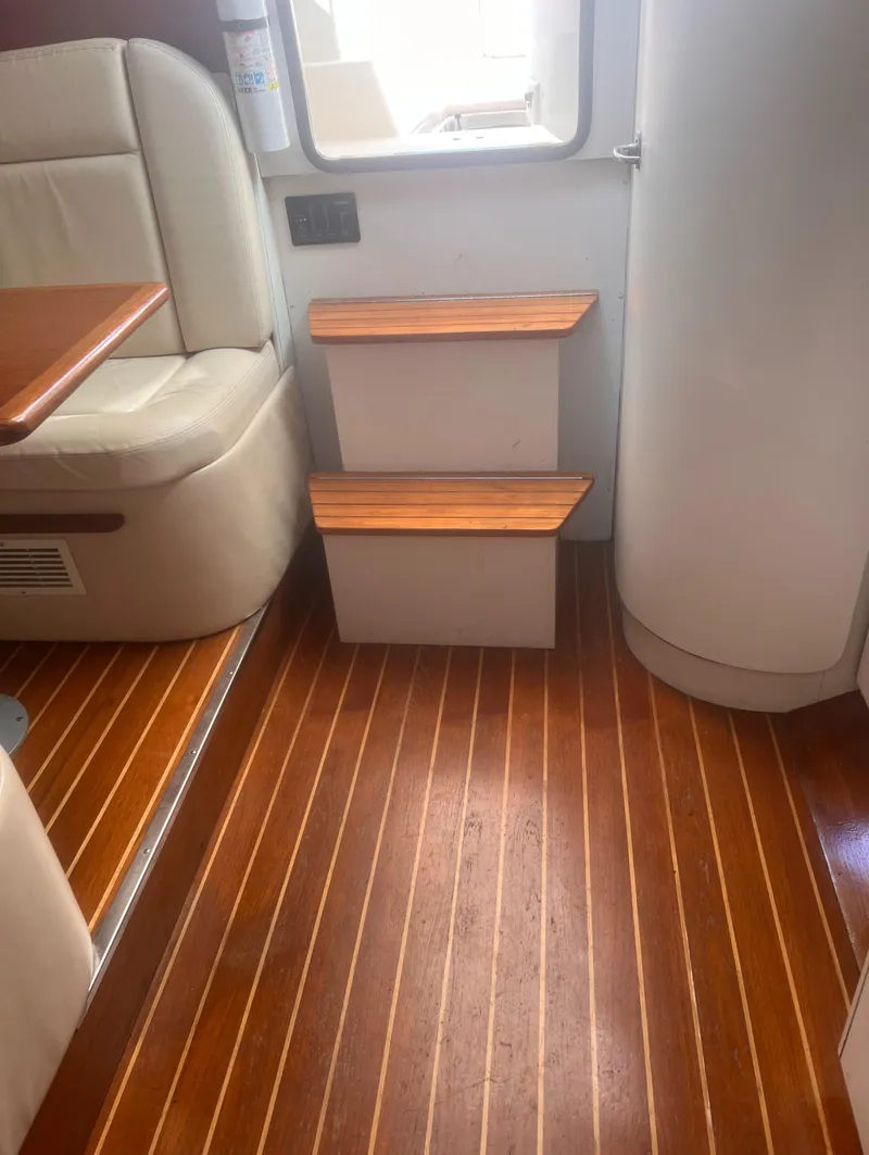 Slide: The Image of Interior of 1995 Tiara Yachts 2900 Open with wooden flooring and steps. - 28