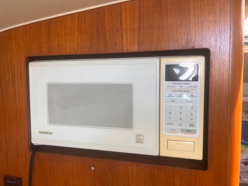 Slide: The Image of GoldStar microwave in 1995 Tiara Yachts 2900 Open, mounted on wooden panel. - 30