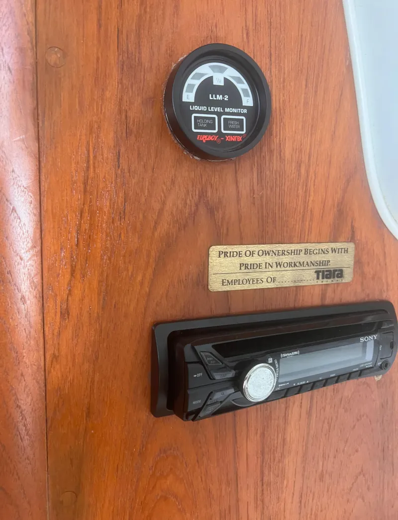 Slide: The Image of 1995 Tiara Yachts 2900 Open dashboard with gauge and Sony stereo system. - 32