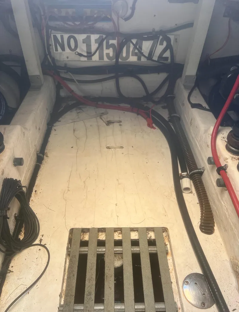 Slide: The Image of Interior view of a 1995 Tiara Yachts 2900 Open, showing wiring and components. - 34