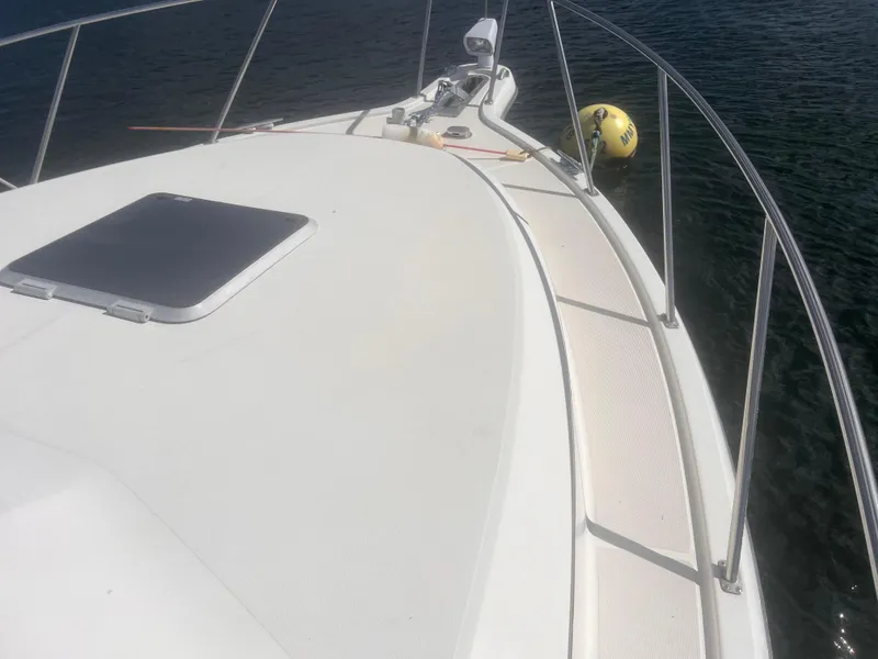 Slide: The Image of 1995 Tiara Yachts 2900 Open boat deck with railing and water view. - 5