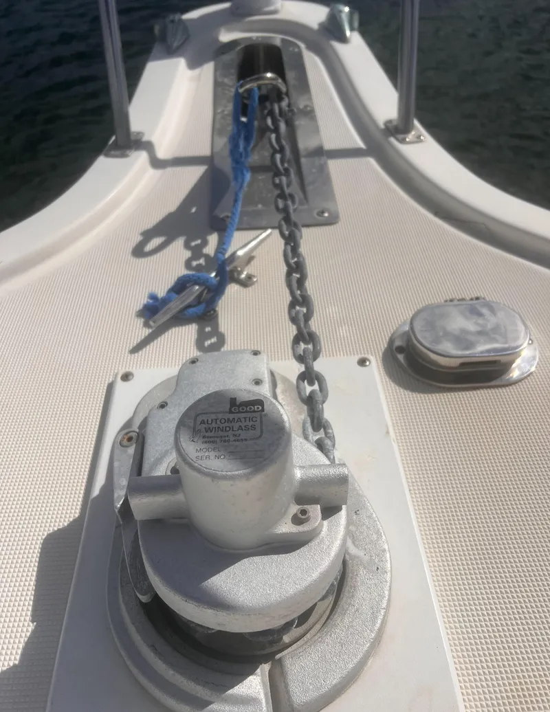 Slide: The Image of 1995 Tiara Yachts 2900 Open deck with anchor chain and windlass. - 7