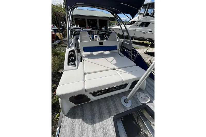 Slide: The Image of 2025 Bennington 25QXSBWA luxury boat with spacious seating and sleek design. - 12