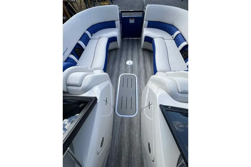 Slide: The Image of Luxurious interior of 2025 Bennington 25QXSBWA boat with plush seating and modern design. - 25