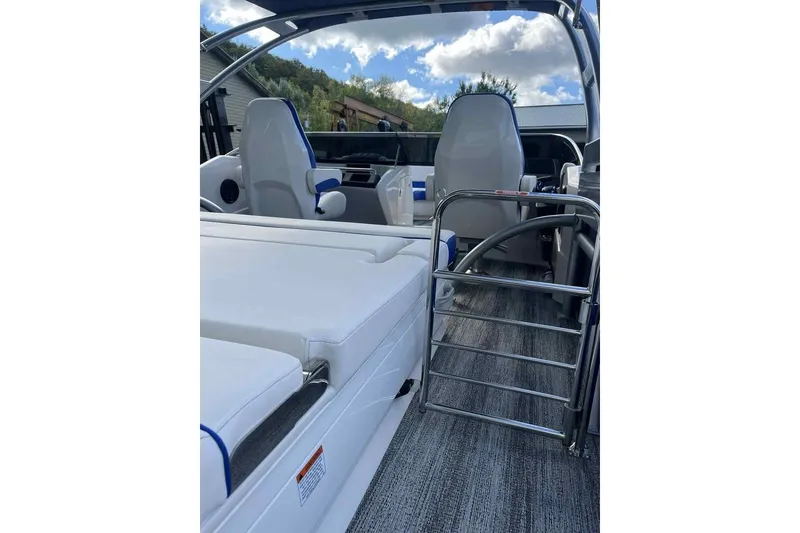 Slide: The Image of 2025 Bennington 25QXSBWA boat interior with sleek seating and modern design. - 26