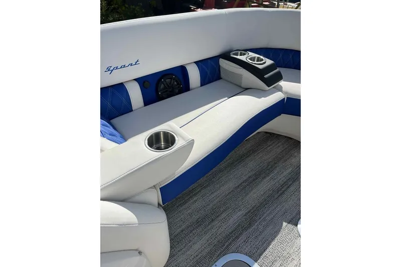 Slide: The Image of Luxurious seating on 2025 Bennington 25QXSBWA boat with cup holders and speaker. - 28
