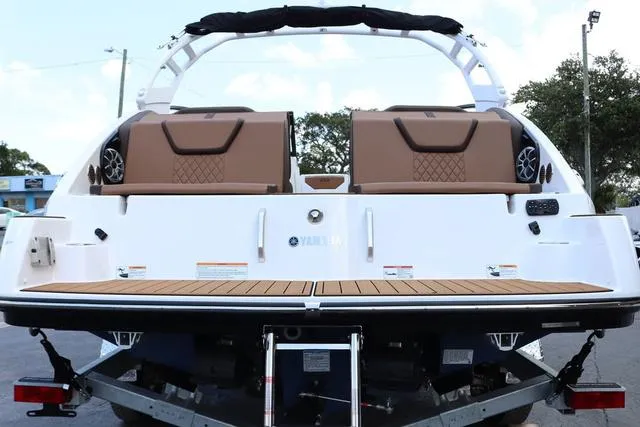 Slide: The Image of 2025 Yamaha Boats 222S dashboard with sleek design and cup holders. - 11