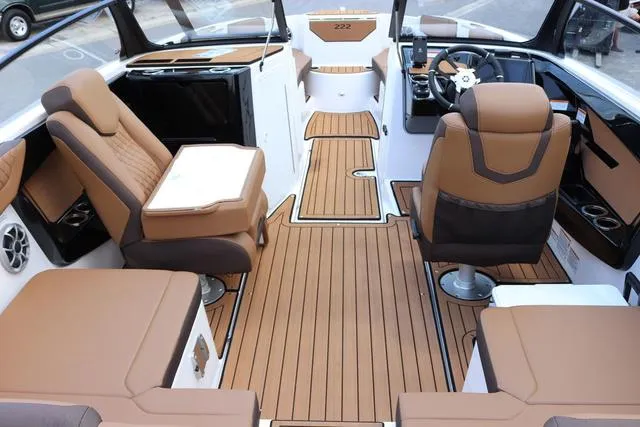 Slide: The Image of 2025 Yamaha Boats 222S, sleek white interior, spacious seating, modern design. - 12