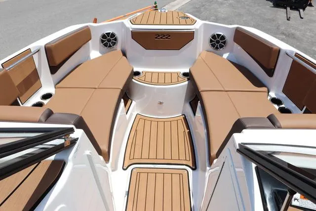 Slide: The Image of 2025 Yamaha Boats 222S, sleek black design, spacious seating, modern features. - 13
