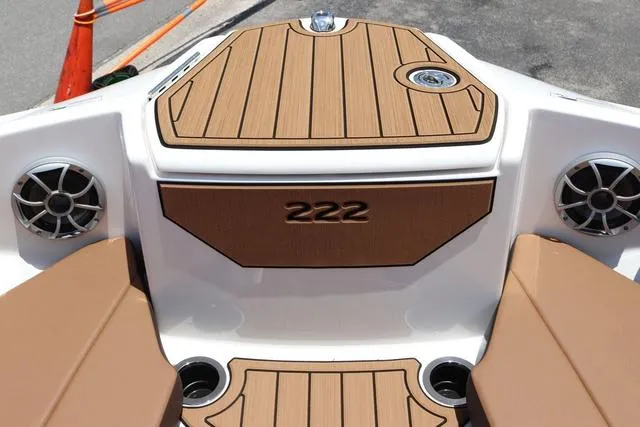 Slide: The Image of 2025 Yamaha Boats 222S, black galvanized model, featuring teak-style deck and speakers. - 16