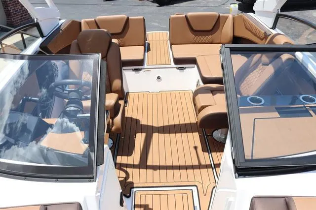 Slide: The Image of 2025 Yamaha Boats 222S interior with tan seating and sleek design. - 17