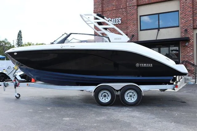 Slide: The Image of 2025 Yamaha Boats 222S in black, featuring sleek design and modern architecture. - 2