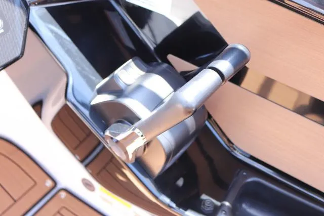 Slide: The Image of Throttle control of 2025 Yamaha Boats 222S, black galvanized model, close-up view. - 21
