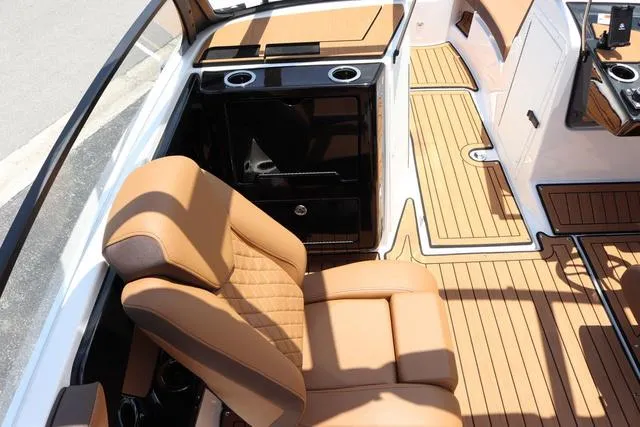 Slide: The Image of 2025 Yamaha Boats 222S interior with tan seating and sleek design. - 23
