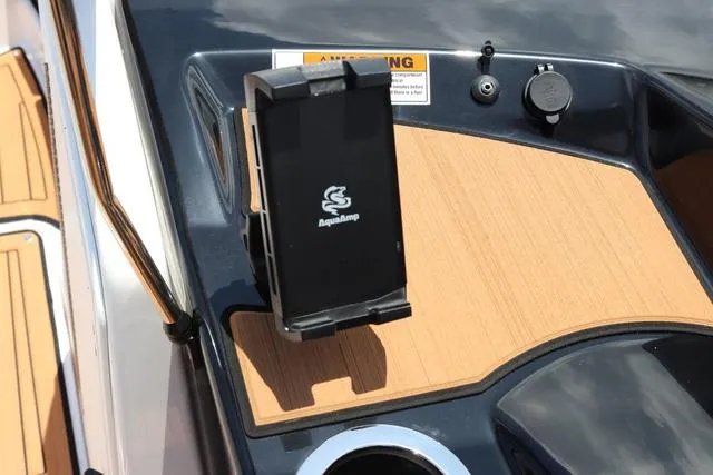 Slide: The Image of Yamaha Boats 2025 model 222S dashboard with phone holder and cup holder. - 25