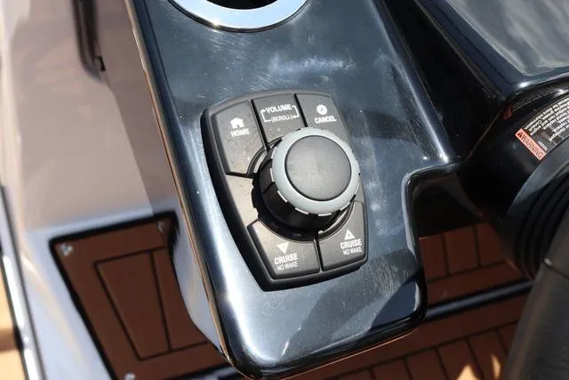 Slide: The Image of Control panel of 2025 Yamaha Boats 222S, featuring cruise and volume controls. - 27