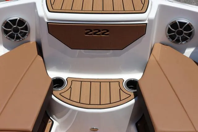 Slide: The Image of 2025 Yamaha Boats 222S interior with brown seating and cup holders. - 31