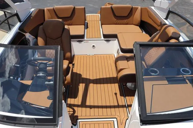 Slide: The Image of 2025 Yamaha Boats 222S interior with tan seating and sleek design. - 32