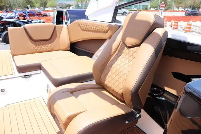 Slide: The Image of 2025 Yamaha Boats 222S interior with luxurious tan seating and modern design. - 33