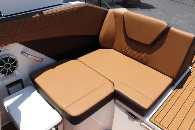 Slide: The Image of 2025 Yamaha Boats 222S interior with tan leather seating and modern design. - 34
