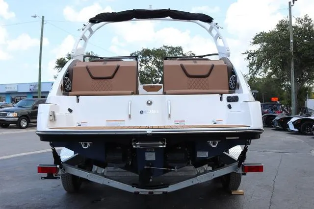 Slide: The Image of 2025 Yamaha Boats 222S, sleek black and white interior, spacious seating, modern design. - 4