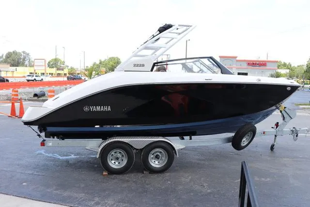 Slide: The Image of 2025 Yamaha Boats 222S interior, featuring sleek white seating and modern design. - 6