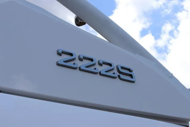 Slide: The Image of 2025 Yamaha Boats 222S dashboard with steering wheel and touchscreen display. - 9