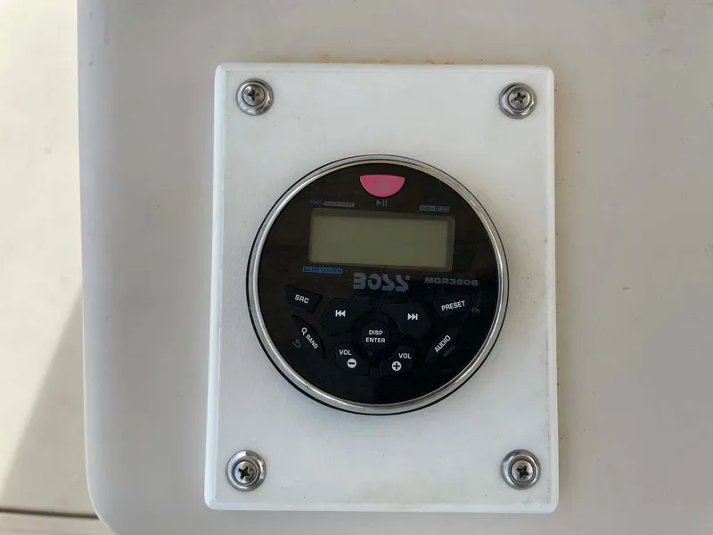 Slide: The Image of Boss audio system on 1989 Rybo Runner Center Console boat. - 13